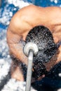 Top view of bare-chested man showering under refreshing freshwater on the cruise ship Royalty Free Stock Photo