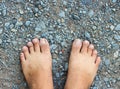 Top View of Bare Foot on Cement Floor Background.