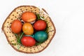 Top view of basket with Easter Eggs. Copy space above white background Royalty Free Stock Photo