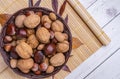 Top view of a basket full of chestnuts, walnuts, hazelnuts, almonds Royalty Free Stock Photo