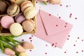 top view basket macarons envelope valentines day. High quality photo