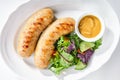 Bavarian Sausages for Frying with Mustard Sauce and Mixed Salad