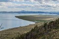 Top view of the bay of lake Baikal with islands, peninsulas, clouds, mountains and hills