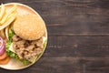 Top view bbq hamburger and french fries on the wooden background Royalty Free Stock Photo