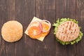 Top view bbq Hamburger parts horizontal on the wooden background Royalty Free Stock Photo