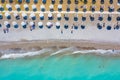 Top view of beach with tourists, sunbeds and umbrellas. Sea travel destination Royalty Free Stock Photo