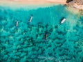 Top view of beach with turquoise sea water and local boats, aerial shot Royalty Free Stock Photo