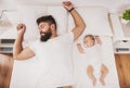 Top view. Bearded Father Sleeps with Baby in Bed.