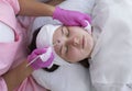 Top View Beautician Does Procedure for Mechanical or Manual Face Cleansing With Cleaner