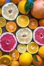 Top view of beautiful display of fresh variety of citrus fruits half cut