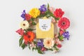 top view of beautiful floral wreath and happy mothers day greeting card in envelope on grey Royalty Free Stock Photo