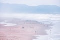 Top view of beautiful landscape in fog, people walking along Ocean Beach, San Francisco. Pacific Ocean Royalty Free Stock Photo