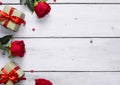 Top view of beautiful red rose, gift box and heart on white wooden background with copy space for text. Valentine day or love Royalty Free Stock Photo