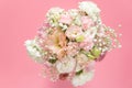 Top view of beautiful romantic bouquet fresh flower on pink background with copy space.