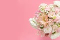 Top view of beautiful romantic bouquet fresh spring flower on pink background with copy space.