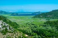 Top view of beautiful summer landscape of Skadar Lake with green and blue water, mountains hills. Montenegro Royalty Free Stock Photo