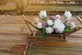 Top view beautiful white flower decoration placed on bamboo table