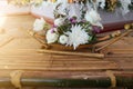 Top view beautiful white flower decoration placed on bamboo table
