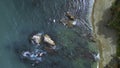 Top view of beautiful wild coast with rocks in water. Clip. Coastline with rocks and waves near shore. Inspiring nature Royalty Free Stock Photo