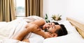 Top view of beautiful young couple sleeping together and hugging in bed at home. Royalty Free Stock Photo