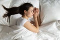 Top view beautiful young woman sleeping in cozy bed Royalty Free Stock Photo