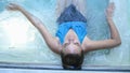 Top of view of beautiful young woman relaxes in a hydromassage jacuzzi, in swimming pool. Concept: spa procedures, body Royalty Free Stock Photo