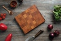 Top view of a beautifully wooden cutting board lies on the table