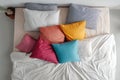 Top View Bed with Colorful Pillows on White Background Royalty Free Stock Photo