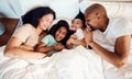 Top view, bed and family with love, relax and quality time with happiness, wellness and bonding. Parents, mother and