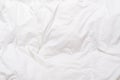 Top view of bedding sheets crease, white blanket texture. Close up of bedding sheets with copy-space