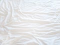 Top view of bedding sheets crease, White Wrinkled Fabric Texture for back ground