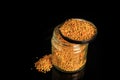 top view of bee pollen grain served in cover of glass jar Royalty Free Stock Photo