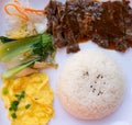 Top view beef fillet with black pepper and rice and cabbage and egg