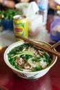 Top view of beef pho including rice noodle, soup and herbs at the restaurant in Sa Pa, Vietnam Royalty Free Stock Photo