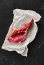 Top view of beef ribeye steak bone-in on wrapping paper Royalty Free Stock Photo