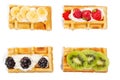 Top view, belgian waffles with strawberries, kiwi, banana and blackberries