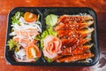 Top view Bento set, Japanese meal in a Box - grilled unagi or eel with rice, salad Royalty Free Stock Photo