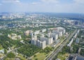 Top view of big city in the summer. Urban panorama of cityscape and blue sky, groups of buildings. Royalty Free Stock Photo