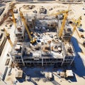 Top view on big construction site with cranes and industrial machines at bright sunny day.