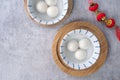 Top view of big tangyuan yuanxiao in a bowl on gray background for lunar new year food