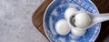 Top view of big tangyuan yuanxiao in a bowl on gray background for lunar new year food