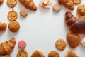 Top view of big variety of sweets on table with empty space in the middle. Free space for advertisement, promotional text