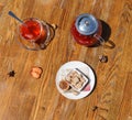 Top view of biscuits and tea. Crunchy cookies and a glass cup of red tea on a table background. Teapot with berry tea. Royalty Free Stock Photo