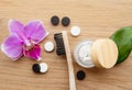 Top view of black activated charcoal and white fluoride toothpaste tablets.