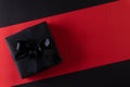 Top view of black christmas boxes with red ribbon on black background with copy space for text. black Friday and Boxing Day Royalty Free Stock Photo