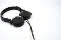 Black color headphone over white background Royalty Free Stock Photo