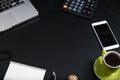 Top view, black desk with computer graph, magnifier and calculator