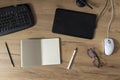 Top view of black digital graphic tablet,stylus,mouse,opened notebook,pen,glasses and keyboard on the wooden table.Workplace for r Royalty Free Stock Photo