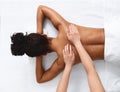 Top view of black lady having healing body massage Royalty Free Stock Photo