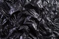 Top view of Black plastic bag texture and background. Reduction of plastic bags for natural treatment. Recycle and World